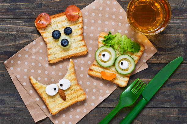 istock Baby Funny toast - breakfast for children. 980805166