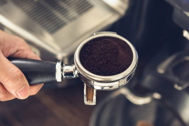 istock Ground coffee in portafilter preparing to brew with machine 980812898