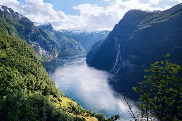 Geirangerfjord fjord. View of the old mountain farm and the Seven Sisters waterfall, Norway. Popular tourist attraction near the city of Geiranger
