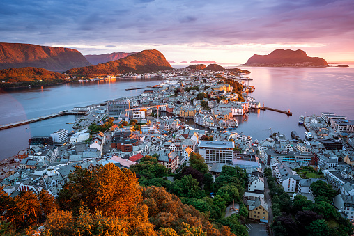 Alesund is a port and tourist city in Norway. Famous tourist attraction. View point on Mount Aksla. Beautiful sunset