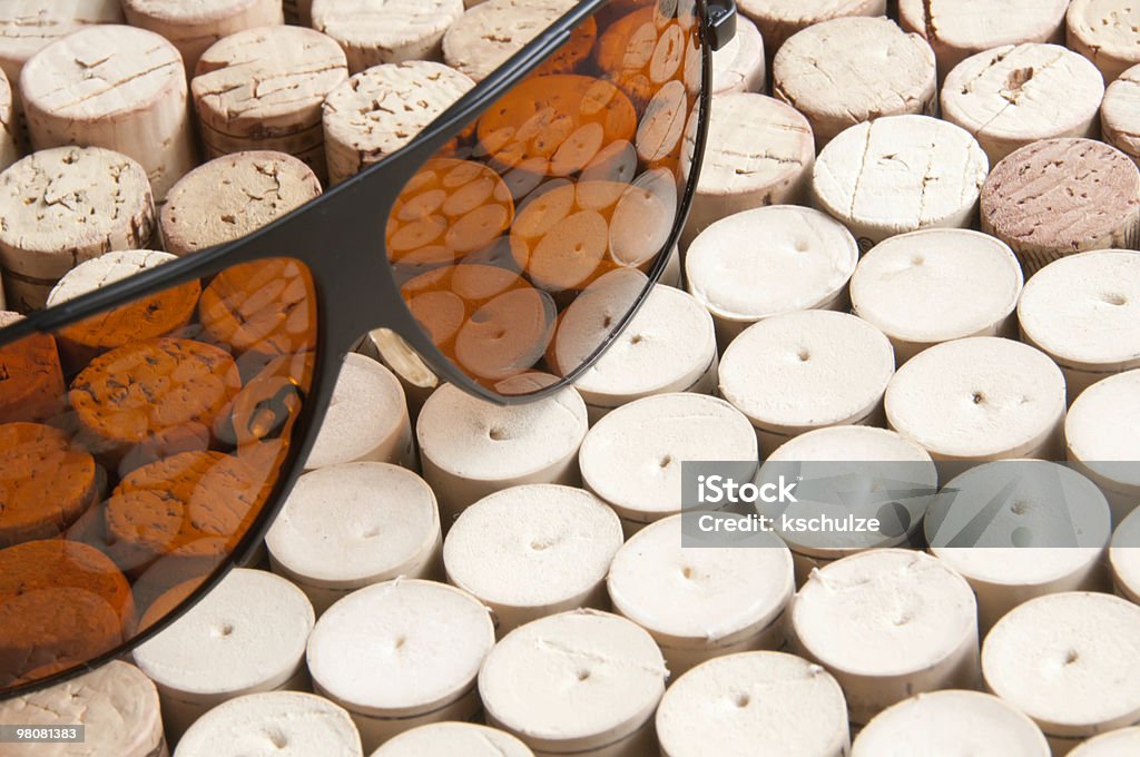 Reflections of a wine lover Pair of sunglasses reflecting many punctured wine corks Bright Stock Photo