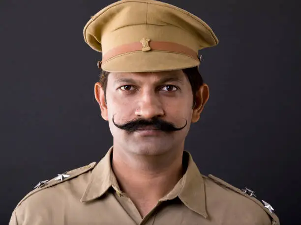Indian Police man in uniform looking at camera