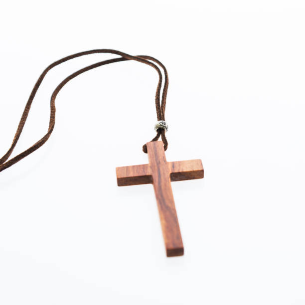 istock Christian cross necklace on white background 980831730
