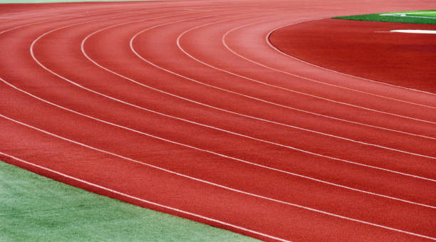 istock Red plastic running track in a playground 980851698