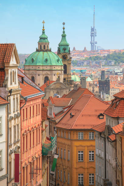 City of Prague A view of the Mala Strana district in Prague, Czech Republic. The church towers belong to St Nicholas Church founded in the 18th century. In the far distance is the Zizkov Television Tower completed in 1992. st nicholas church prague stock pictures, royalty-free photos & images