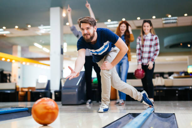 istock Friends bowling at club 980868140