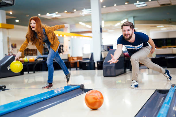 istock Friends enjoying bowling at club 980868204