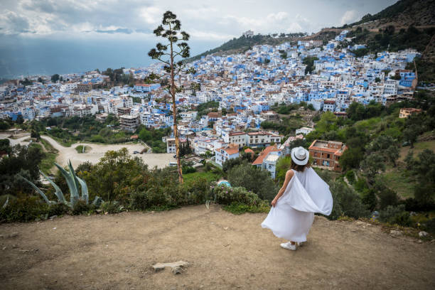 istock Woman visiting Chefchaouen, Morocco 980880064