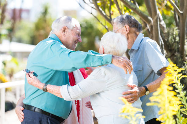 istock Friends embracing outdoors 980888310