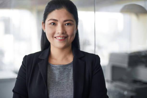 istock Confident businesswoman standing in office 980900046