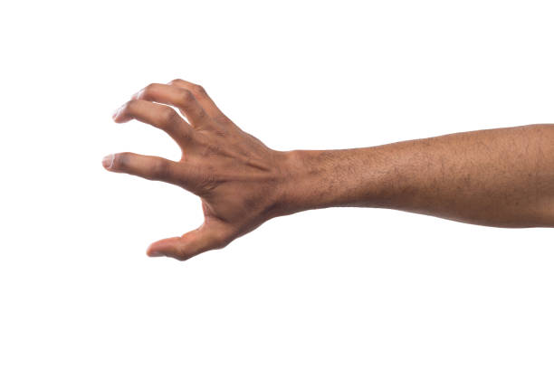 istock Black male hand picking up something, cutout 980930966