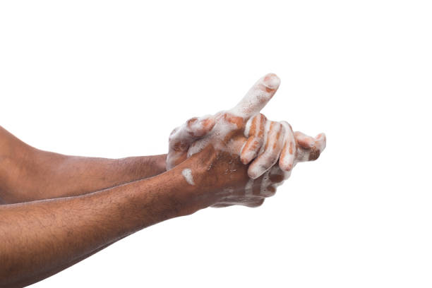 istock Black man washing hands isolated on white background 980931868