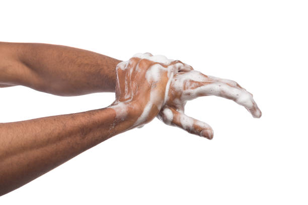 istock Black man washing hands isolated on white background 980931916