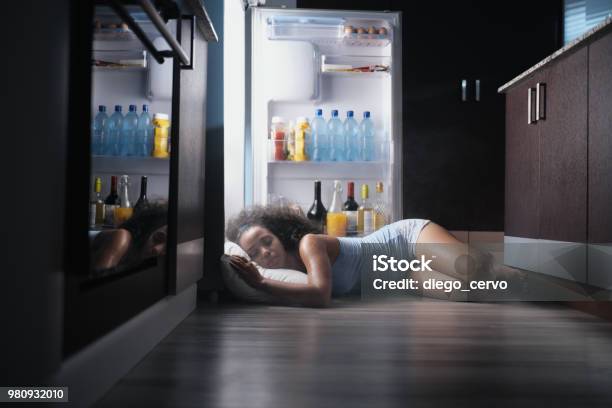 Black Woman Awake For Heat Wave Sleeping In Fridge Stock Photo - Download Image Now - Heat - Temperature, Sleeping, Heat Wave