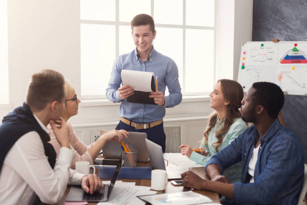 istock Man giving presentation to colleagues in office 980932058