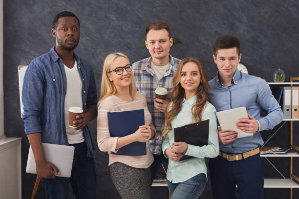 istock Confident business people posing in office 980936382