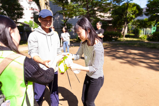 istock Group of volunteers getting ready to clean up pubic park 980937210