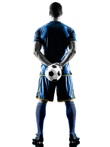 istock soccer player man standing back  silhouette isolated 980941774