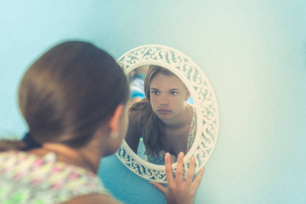 istock Sad girl in the mirror 980947778
