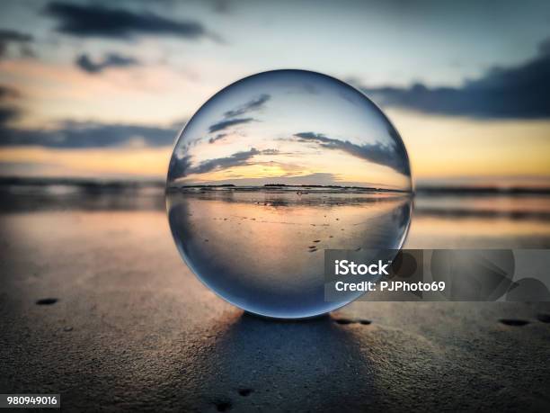 Watching Sunrise Throught A Lens Ball Riviera Romagnola Stock Photo - Download Image Now