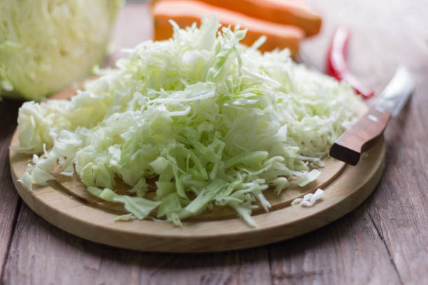 istock white cabbage cut into strips and carrots for cooking 980953658