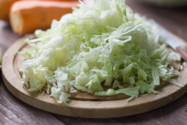 istock white cabbage cut into strips and carrots for cooking 980954534