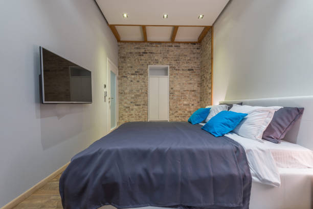 istock Retro designed bedroom with brick wall 980955050