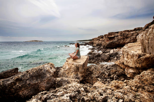 istock Yoga on the beach, meditation 980958526