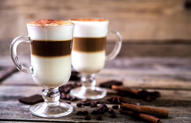 Coffee in glass on the wooden background Coffee in glass on the wooden background a macchiato stock pictures, royalty-free photos & images