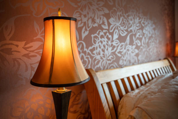 istock Cozy nice comfortable bed and the night lamp 980962950