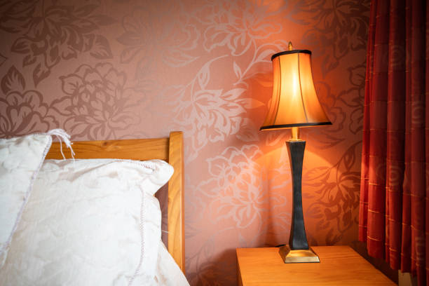 istock Cozy nice comfortable bed and the night lamp 980963088