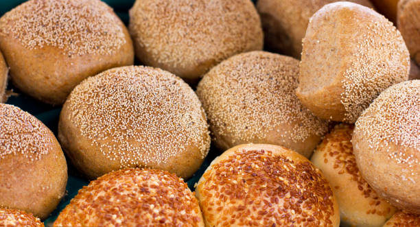 istock Fresh buns from yeast dough with the sesame and poppy seeds 980963696