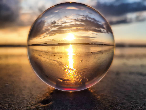 istock Watching sunrise throught a lens ball - Riviera Romagnola 980965340