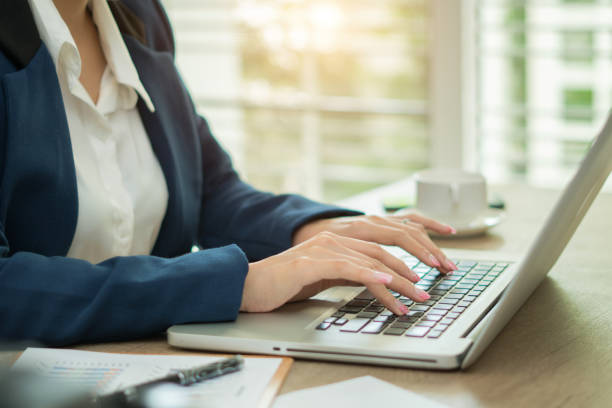 istock Woman working at home office hand on keyboard close up 980969500