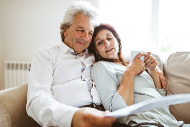 istock senior couple resting on the sofa 980978324