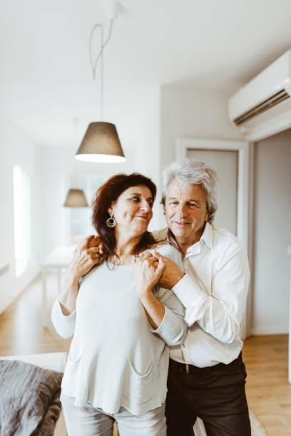 istock passionate senior couple portrait at home 980978628