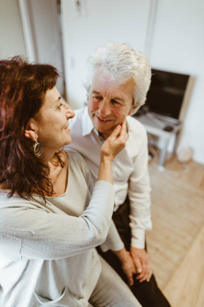 istock passionate senior couple portrait at home 980978802