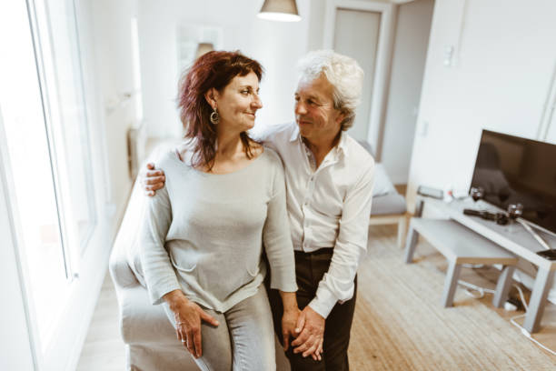 istock passionate senior couple portrait at home 980979012