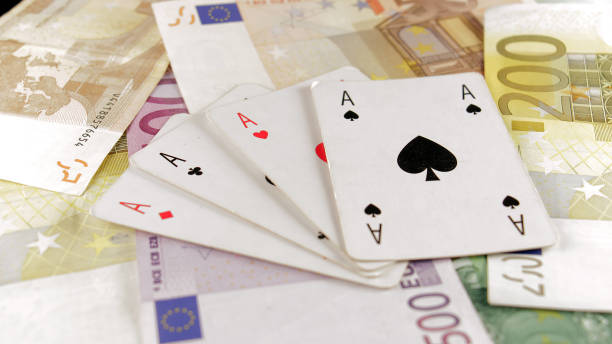 istock Poker Cards On Euro Money 980979544