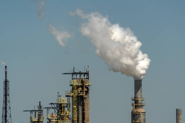 istock oil refinery smoking chimney detail 980989450