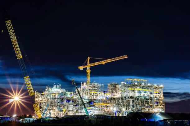 istock Crane and building construction site at sunset. Engineer Concept 980989938