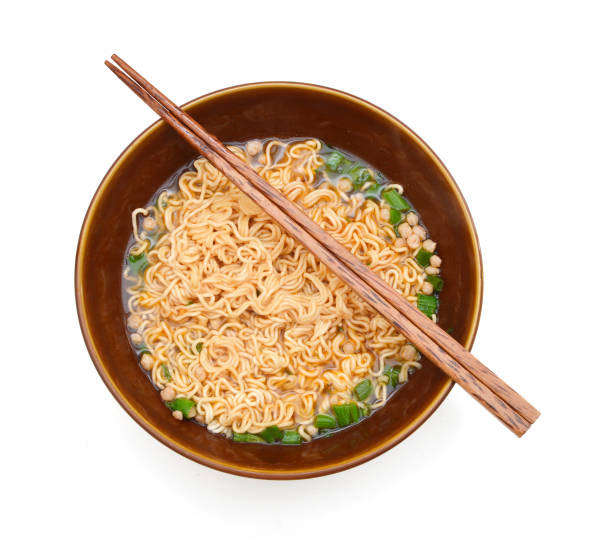 istock Eating instant noodle  bowl isolated on white background 980993062