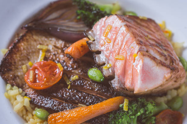 Salmon Fillet with Vegetables on Rustic White Plate