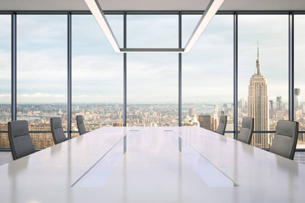 istock Large modern office desk with view at the skyscrapers 981003096