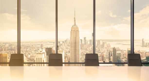 istock Large modern office desk with view at the skyscrapers 981003098