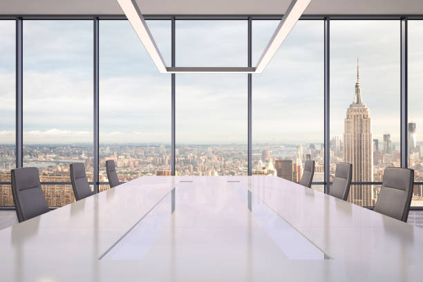 istock Large modern office desk with view at the skyscrapers 981003100