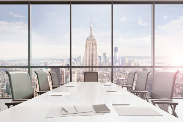 istock Large modern office desk with view at the skyscrapers 981003106