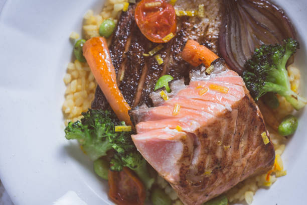 Salmon Fillet with Vegetables on Rustic White Plate