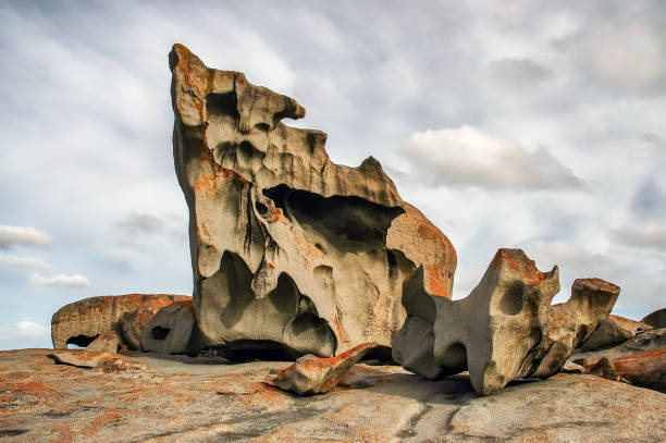 View of unusual rock formations covered in orange lichen, known as Remarkable Rocks, in Kangaroo Island, Australia.