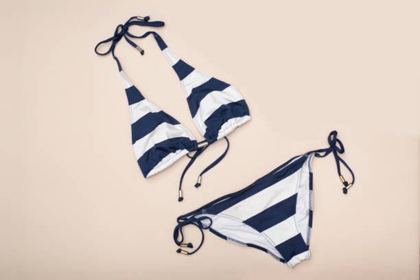 istock Striped swimsuit. Beach wardrobe. Fashionable concept 981029794